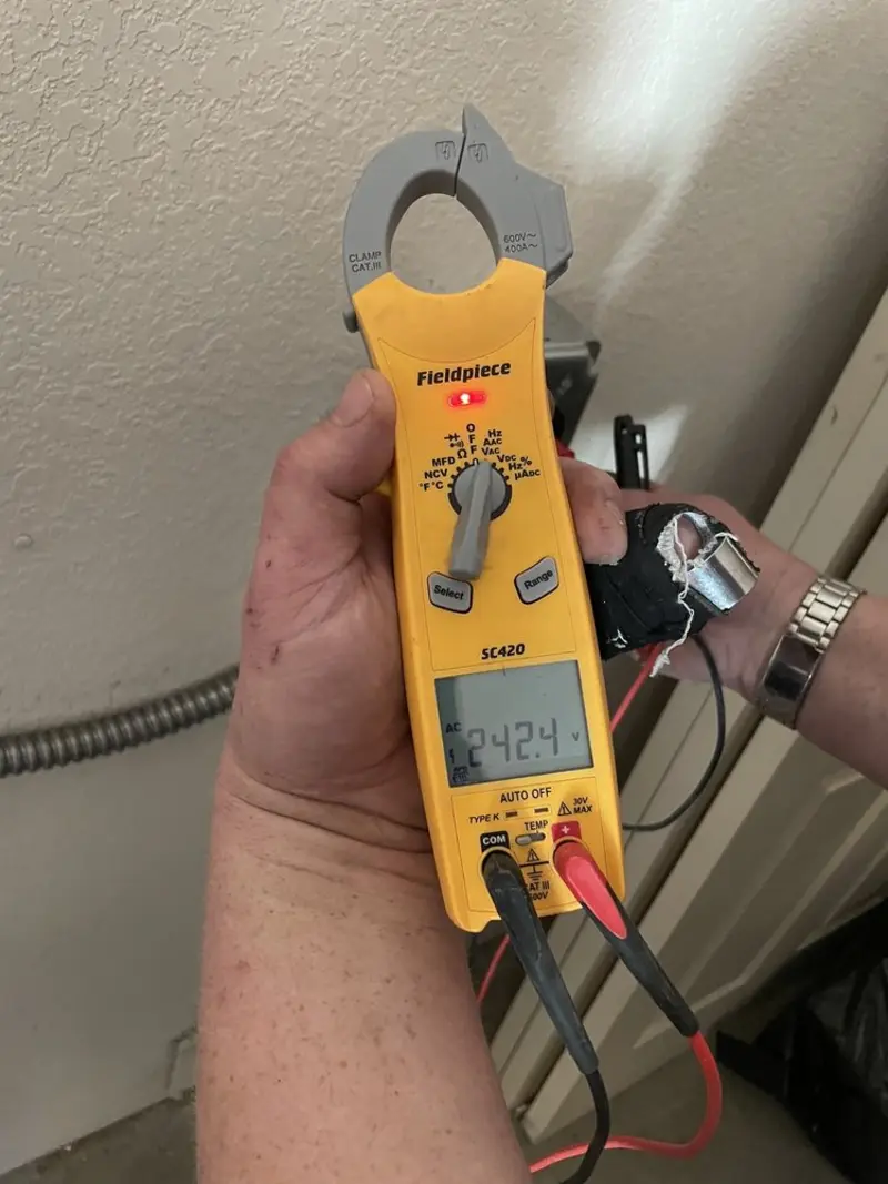 Voltage testing with clamp meter during Recessed Lighting Installation in Susquehanna